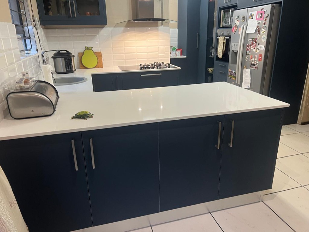 Tall joinery with glass display and built-in oven stack