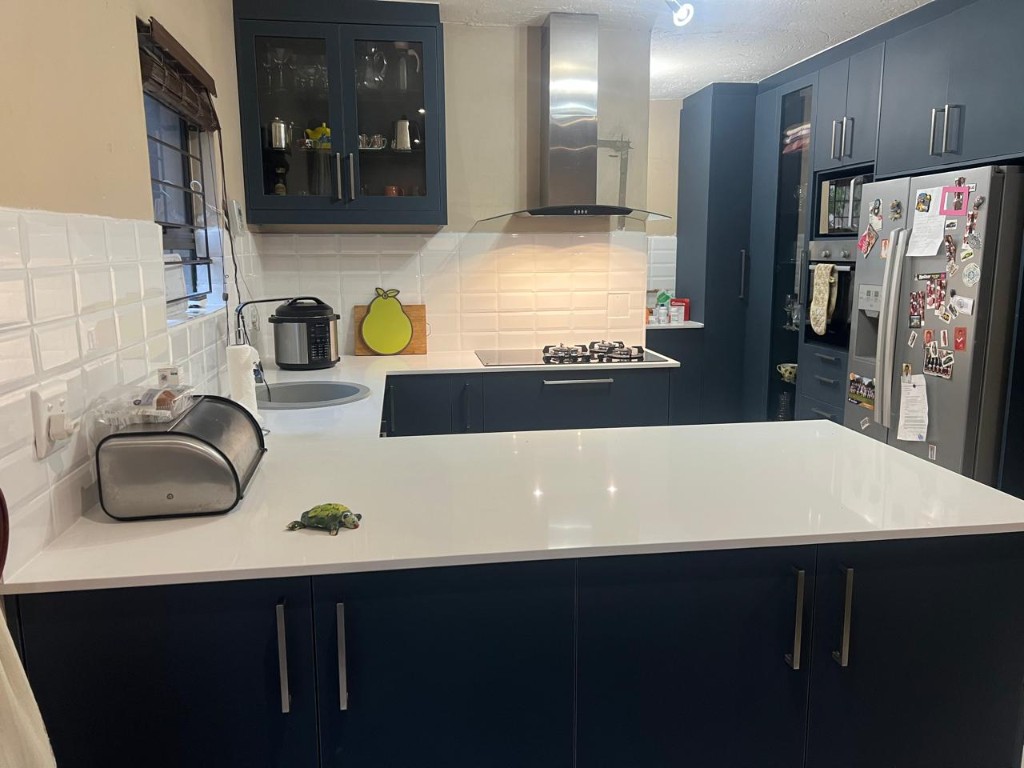 Appliance wall with integrated refrigerator